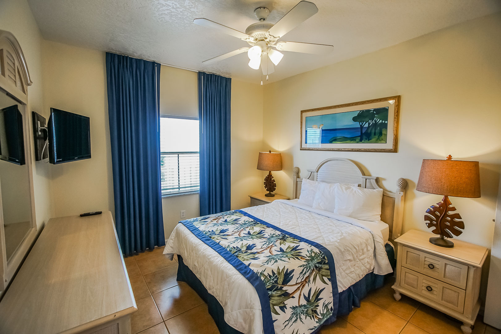 A vibrant master bedroom at VRI's Discovery Beach Resort in Cocoa Beach, Florida.